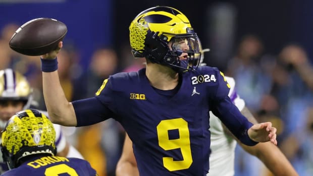 Jan 8, 2024; Houston, TX, USA; Michigan Wolverines quarterback J.J. McCarthy (9) passes the ball against the Washington Huskies during the third quarter in the 2024 College Football Playoff national championship game at NRG Stadium.